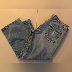 D&G Dolce & Gabbana | women’s distressed Zigzag cropped jeans.